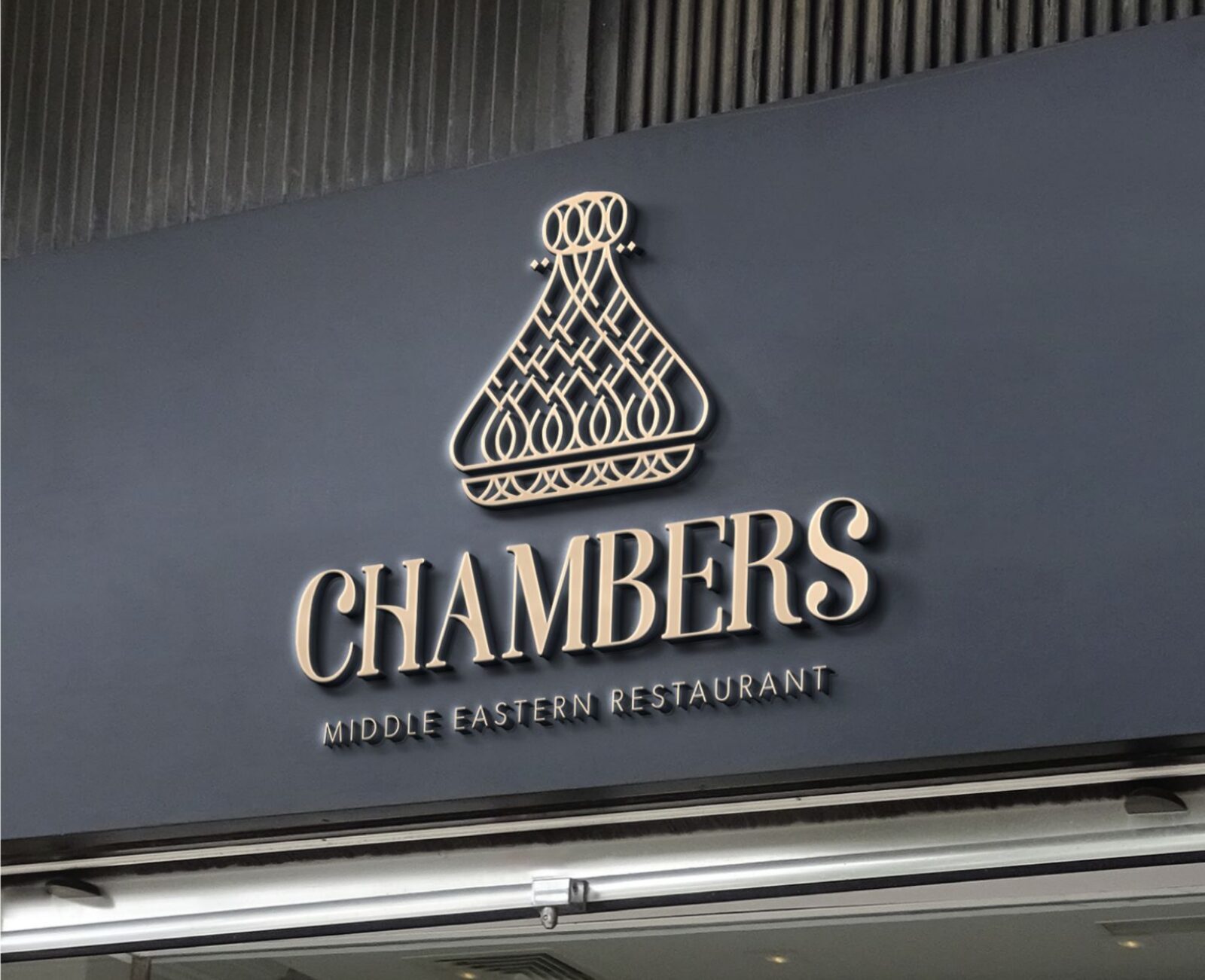The Chambers logo in lit letters on a dark shopfront